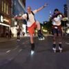 Inline skater navigating the night with LED wheel lights and high-visibility gear. Explore the best night skating equipment for a safe and exhilarating experience