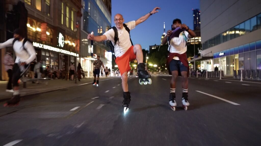 Inline skater navigating the night with LED wheel lights and high-visibility gear. Explore the best night skating equipment for a safe and exhilarating experience