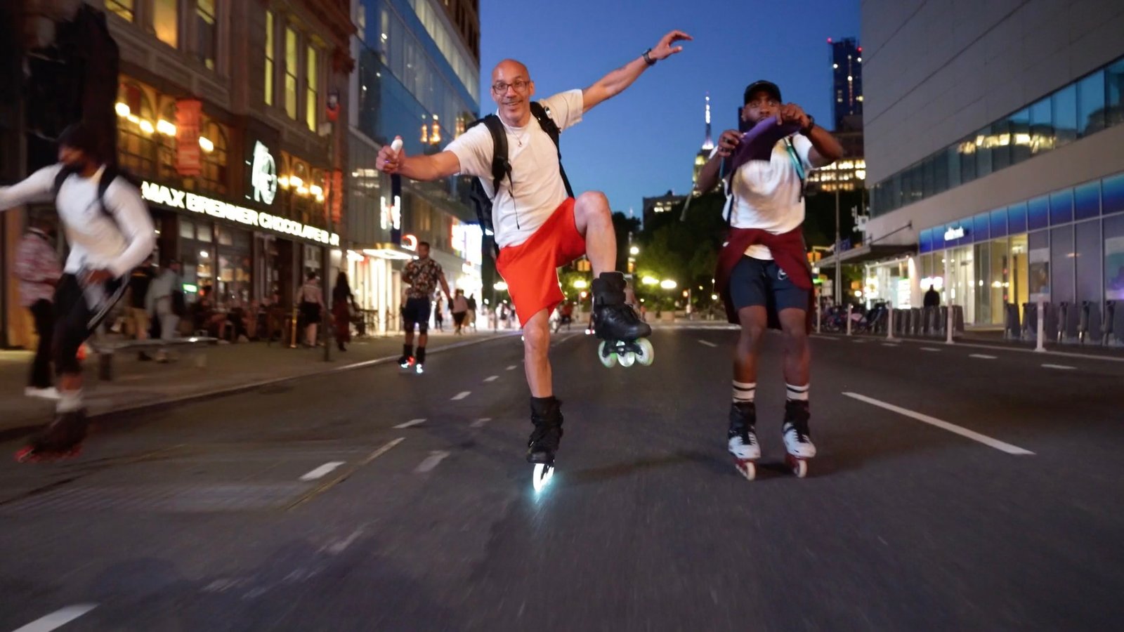 Inline skater navigating the night with LED wheel lights and high-visibility gear. Explore the best night skating equipment for a safe and exhilarating experience