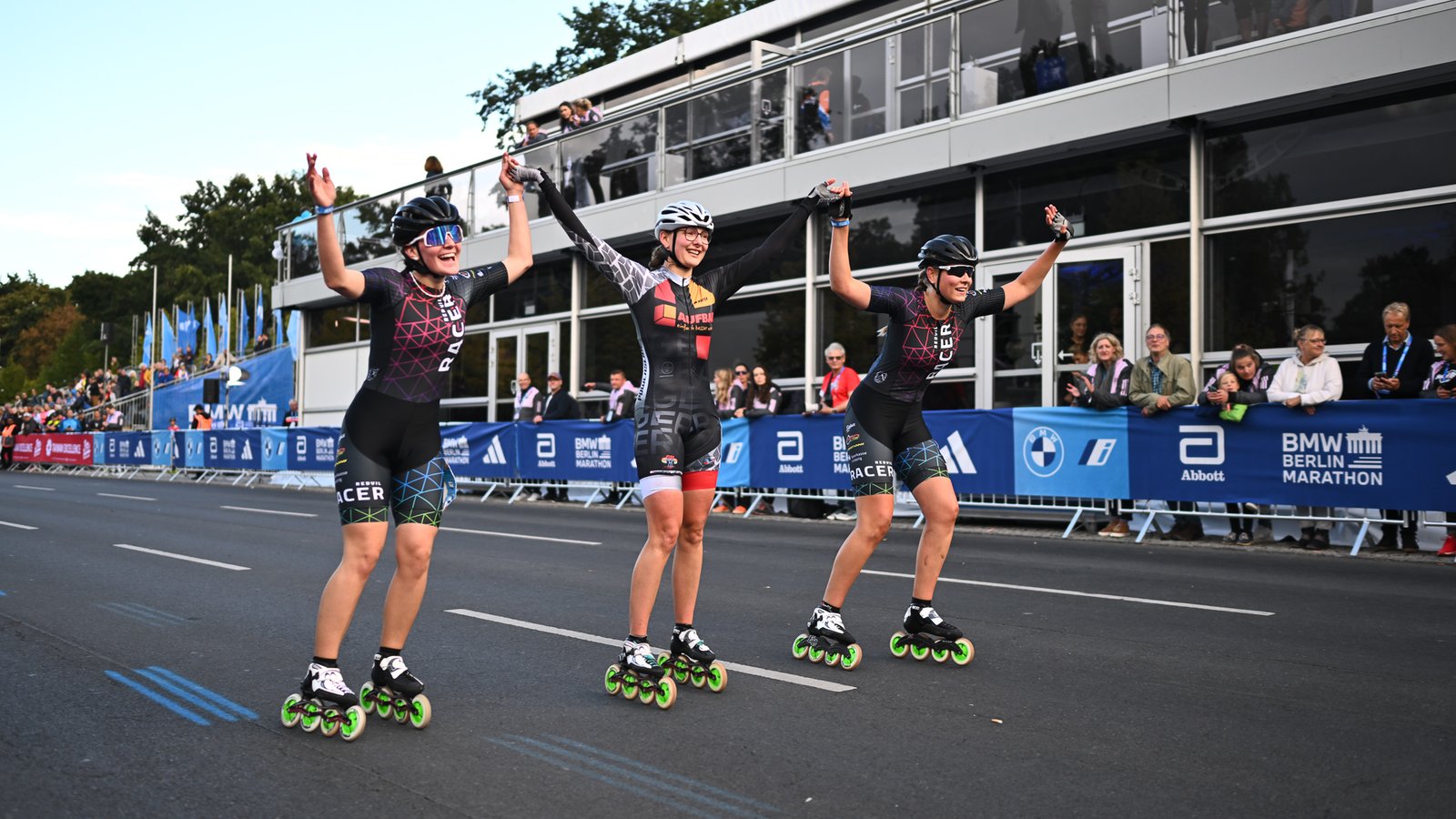 Inline skaters competing in the Berlin Marathon, gliding against a backdrop of historic landmarks in vibrant Berlin.