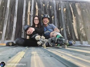 A person wearing inline skates glides smoothly on a paved trail, demonstrating the therapeutic benefits of inline skating in physical rehabilitation.