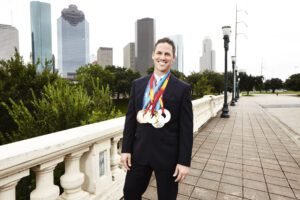 Chad Hedrick in a speed skating race, demonstrating his exceptional skill and determination on the ice.